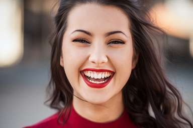 Woman laughing in red